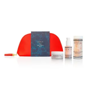 Red pouch with Oskia products: mask, body treatment, moon salts, and a booklet.