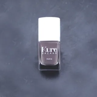 Kure Bazaar nail polish bottle on a dark surface.