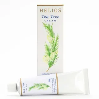 Helios Tea Tree Cream box and tube with green leaf design.