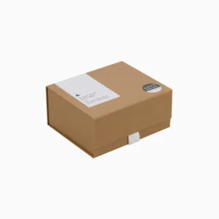 Brown gift box with "Sleep Easy Gift Box" label and round sticker on top.