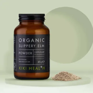 Brown jar of organic slippery elm powder, 45g, by Kiki Health, with powder beside it.
