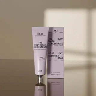 AKT SC.05 Body Wash Concentrate tube and box on reflective surface.