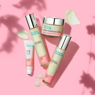 Skincare products on pink background: face cream, serum, eye gel, with cream swatches.