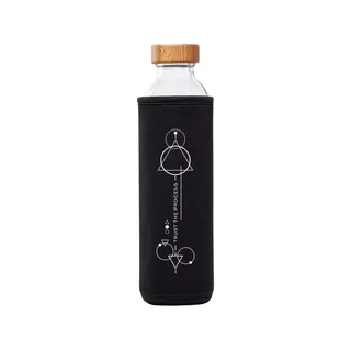 Glass bottle with wooden lid in black sleeve, geometric design, text: "Trust the Process".