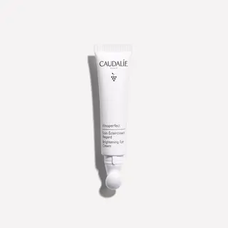 Caudalie Vinoperfect Brightening Eye Cream tube on white background.