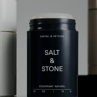 Black deodorant stick labelled "Salt & Stone", "Santal & Vetiver".