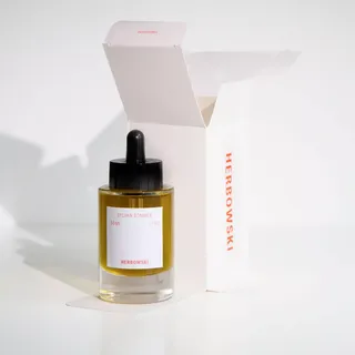 Glass bottle of Sylvan Sommer oil, 50ml, with dropper, beside open Herbowski box.