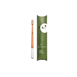 Bamboo toothbrush with white bristles, green packaging with panda illustration, text: "tiny truthbrush".