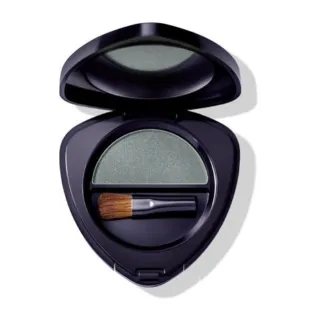 Open compact with green eyeshadow and small brush inside.