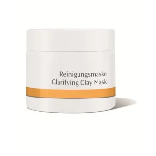 White jar labelled "Reinigungsmaske Clarifying Clay Mask" with orange stripe.
