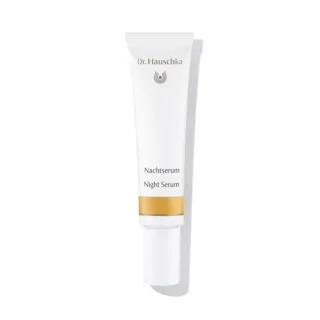 Dr. Hauschka Night Serum tube with gold band, white background.