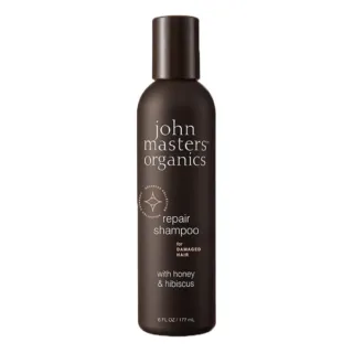 Brown bottle of John Masters Organics repair shampoo, 177 ml, with honey and hibiscus.