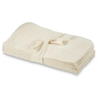Stack of cream-coloured muslin cloths tied with a ribbon.