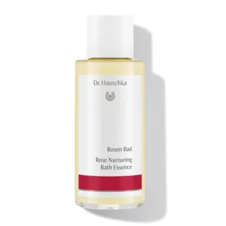Dr. Hauschka Rose Nurturing Bath Essence bottle with red label.