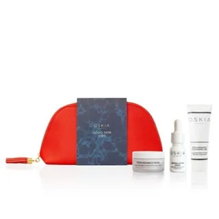 Red pouch with Oskia skincare products and "Good Skin Edit" card.
