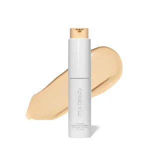 White bottle of rms beauty foundation with beige swatch behind.