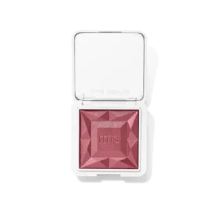 Open compact with pink blush, embossed "rms beauty" on lid.