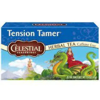 Celestial Seasonings Tension Tamer herbal tea box with dragon and castle illustration.