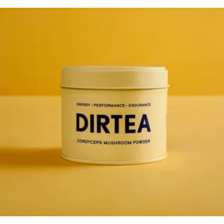 DIRTEA Cordyceps Mushroom Powder tin on yellow background.