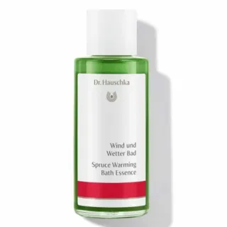 Dr. Hauschka Spruce Warming Bath Essence in a green bottle with white cap.
