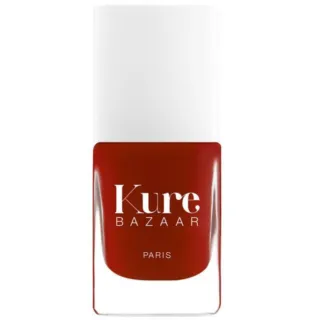 Red nail polish bottle with "Kure Bazaar Paris" text.