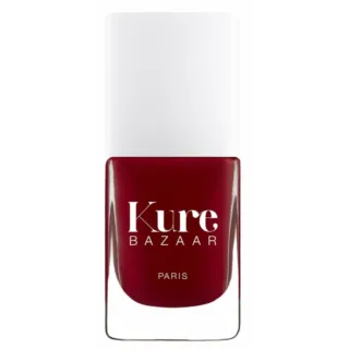 Red nail polish bottle with "Kure Bazaar Paris" text.