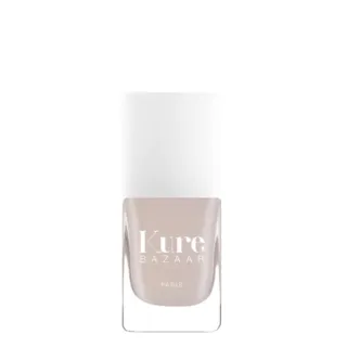 Kure Bazaar nail polish bottle with white cap and beige colour.