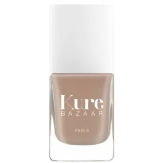 Kure Bazaar nail polish bottle with beige colour and white cap.