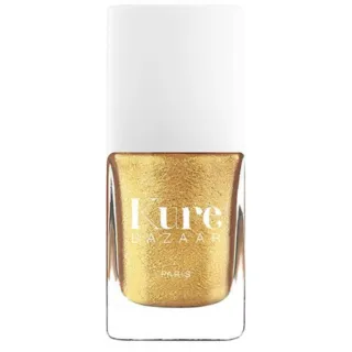 Gold nail polish bottle with white cap, labelled "Kure Bazaar Paris".