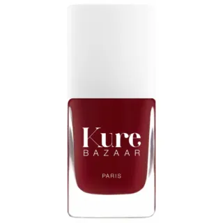 Kure Bazaar Paris nail polish in deep red bottle with white cap.
