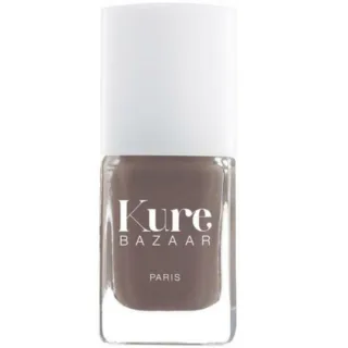 Kure Bazaar nail polish bottle with brown shade and white cap.