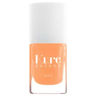 Kure Bazaar orange nail polish bottle with white cap.