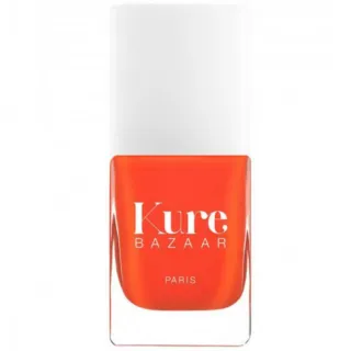 Kure Bazaar orange nail polish bottle with white cap.