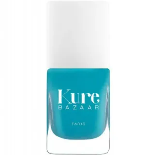 Turquoise nail polish bottle with "Kure Bazaar Paris" text.