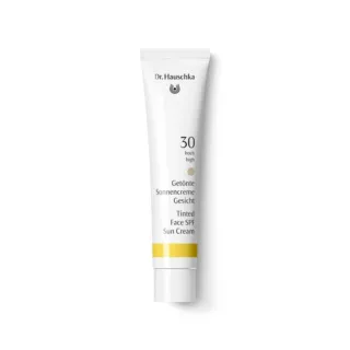 Dr. Hauschka Tinted Face SPF 30 Sun Cream tube on white background.
