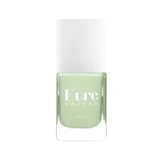 Kure Bazaar Paris light green nail polish bottle with white cap.