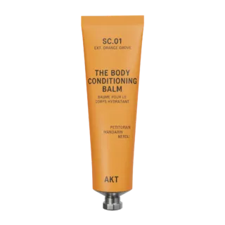Orange tube labelled "The Body Conditioning Balm" by AKT. Contains petitgrain, mandarin, neroli.