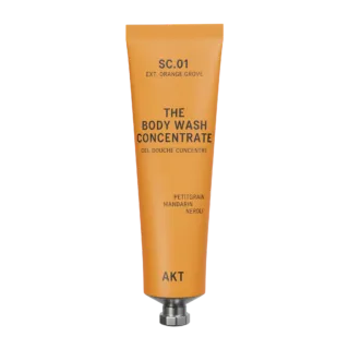 Orange tube of AKT body wash concentrate with citrus scents.