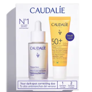 Caudalie dark spot serum and SPF 50+ cream duo in packaging.