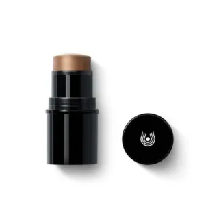 Black makeup stick with brown tip, cap beside it, white logo on cap.