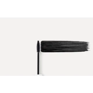 Mascara wand with black mascara stroke on a white background.