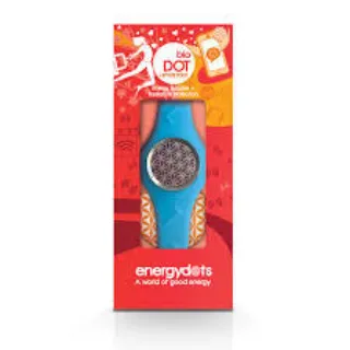 Blue energyDOTS device in red packaging with geometric design and text "A world of good energy".