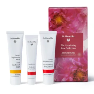 Dr. Hauschka Nourishing Rose Collection with day, hand, and body creams in front of floral box.