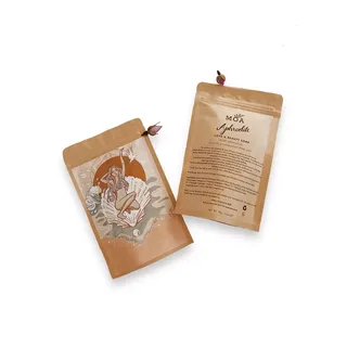 Two brown pouches of MOA Aphrodite Love & Beauty Soak with floral design and text.