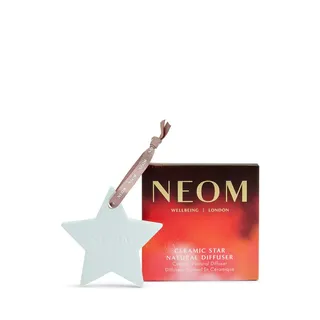 Ceramic star diffuser with ribbon beside NEOM branded box.