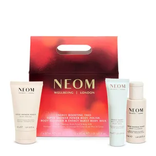 NEOM Wellbeing London gift set with body polish, cleanser, and body milk in red packaging.