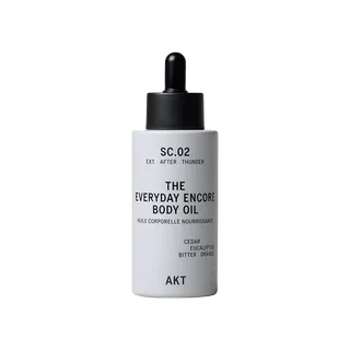 White bottle of AKT Everyday Encore Body Oil with dropper lid.