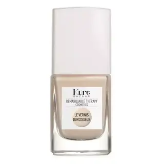 Kure Bazaar nail polish bottle with white cap and beige colour. Label reads "Le Vernis Durcisseur".