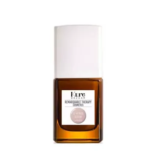 Brown bottle with white cap, labelled "Kure Bazaar Remarkable Therapy Cosmetics".