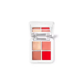 Open compact with four shades of blush in a white case.